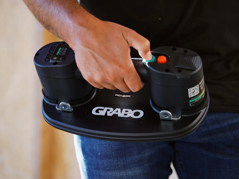GRABO Pro Lifter 20 met digitale drukmeter en bediening in de hand